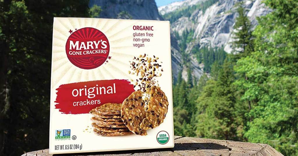 box of crackers on a stone with a mountain in the background