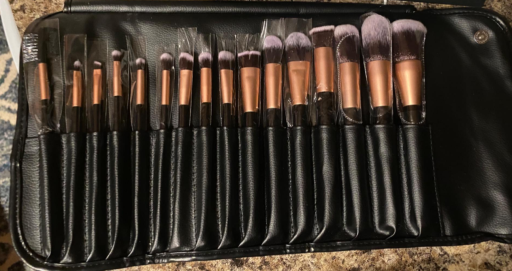 row of makeup brushes in a case