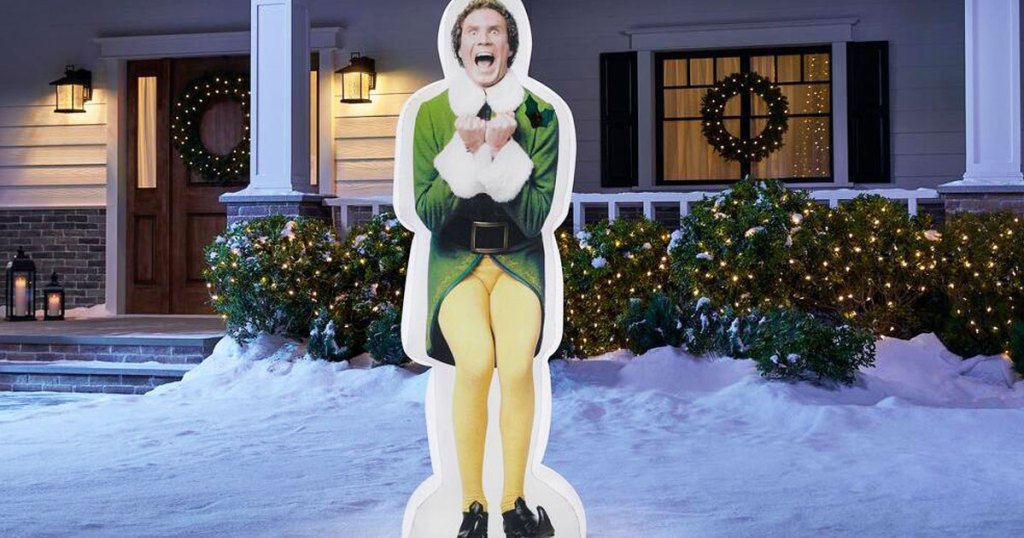 buddy the elf inflatable in a snowy front yard