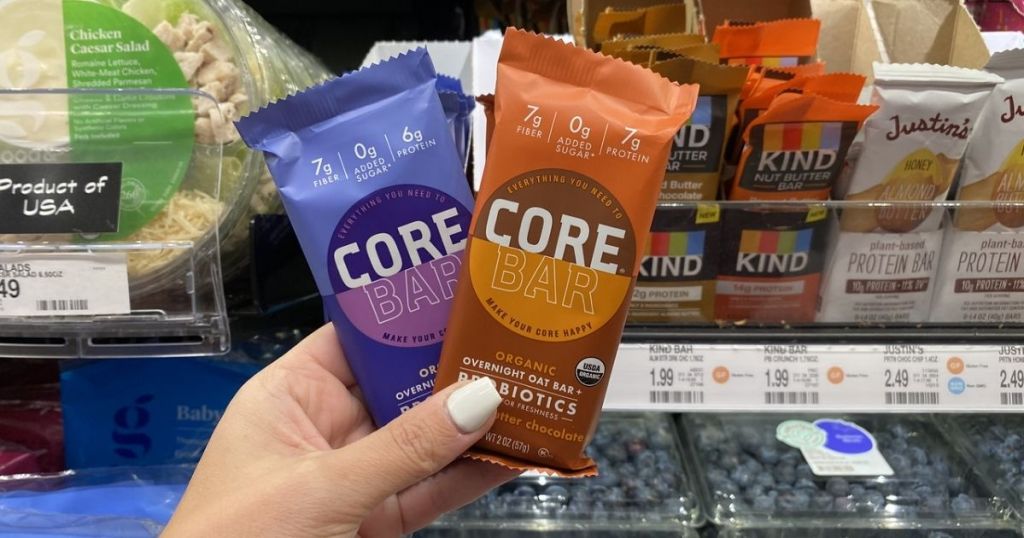 Woman Holding two Core Organic Oat Bars