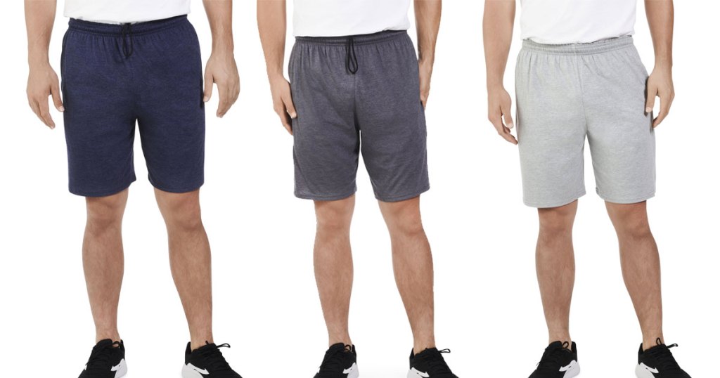 three men modeling jersey shorts in navy blue, dark grey, and light grey colors