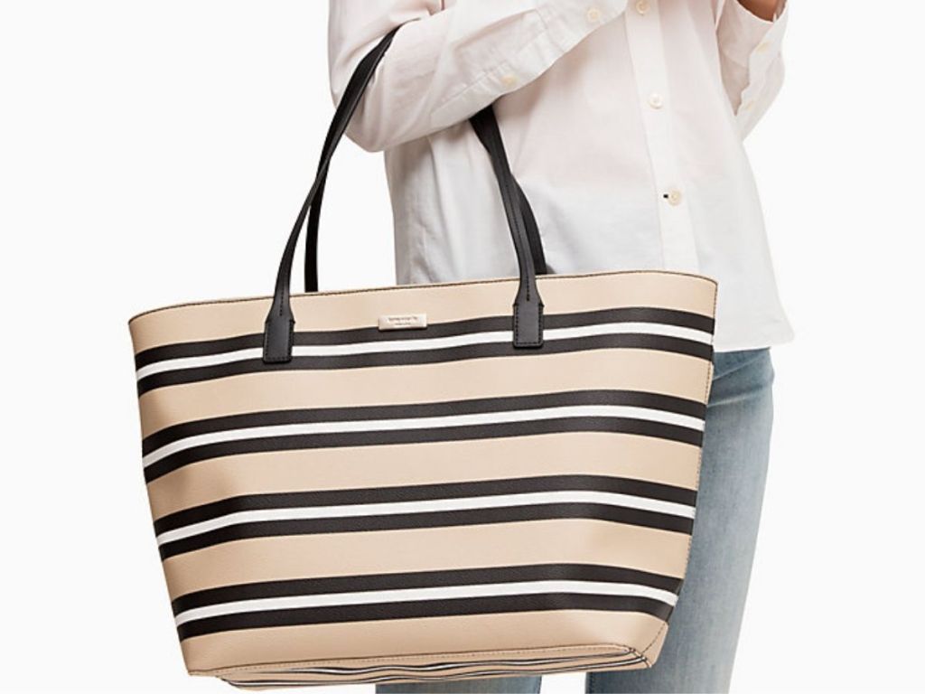 lady holding Kate Spade Margareta Tote