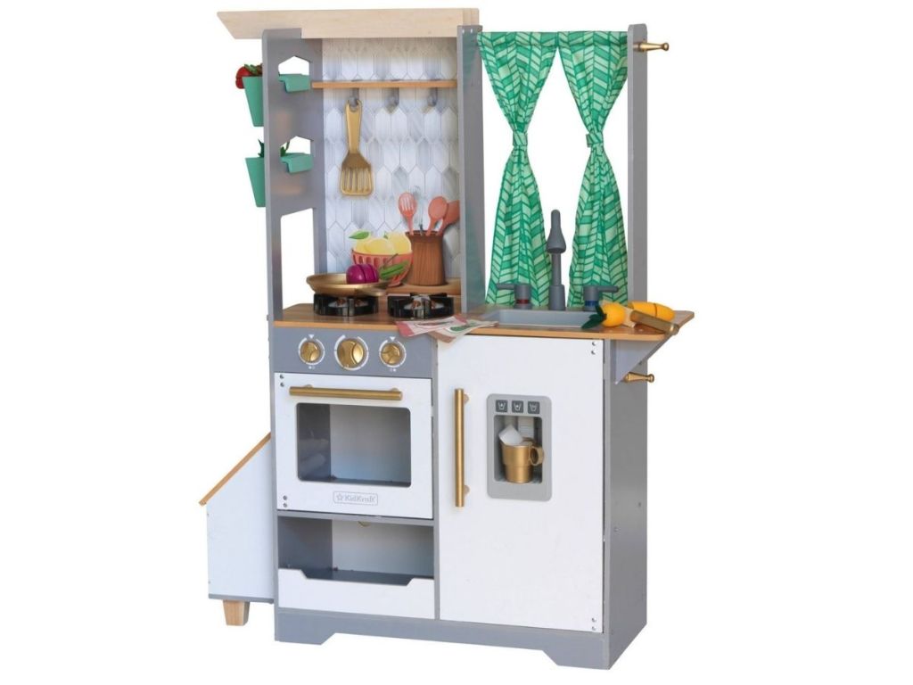 play kitchen with a stove and curtains