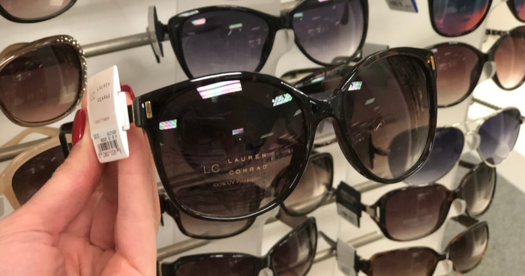 woman's hand holding LC Lauren Conrad Sunglasses at kohl's