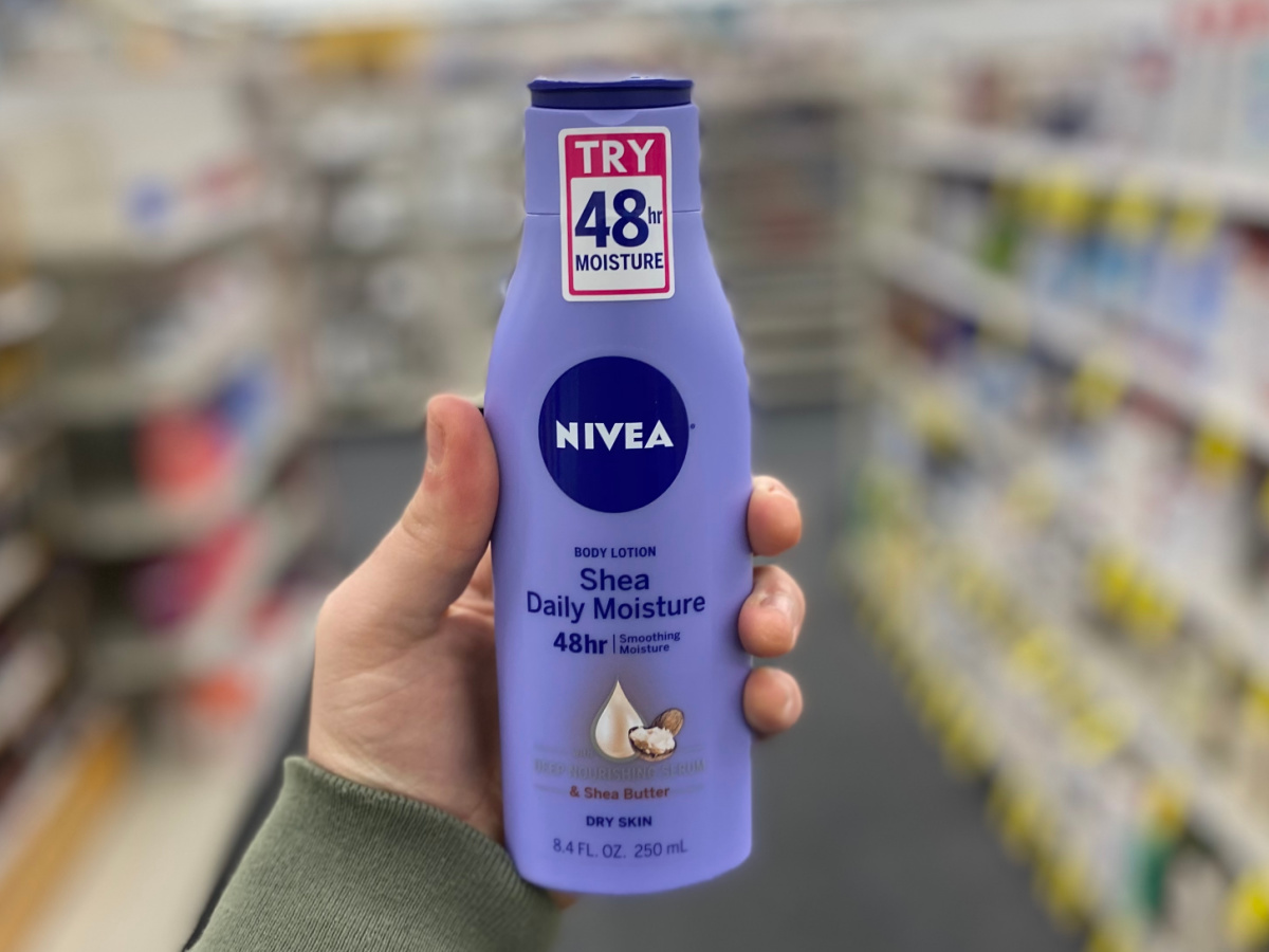 hand holding nivea lotion at cvs