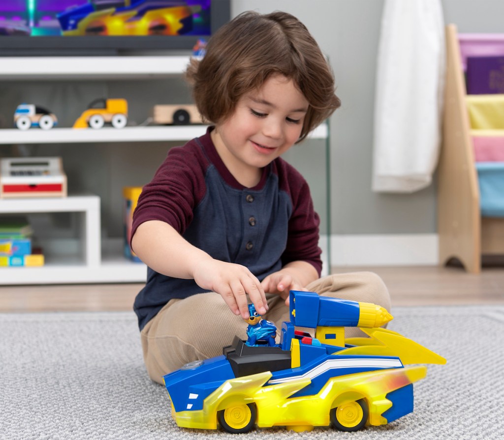 boy playing with PAW Patrol True Metal Mighty Meteor Die-Cast Track Set with Exclusive Chase Vehicle