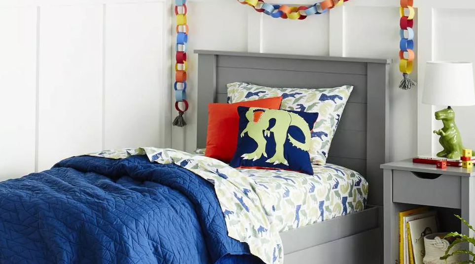 kids room with dinosaur decor and bedding