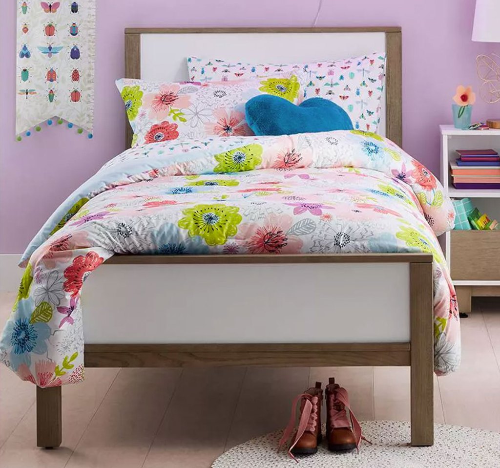 floral print comforter on a kids bed