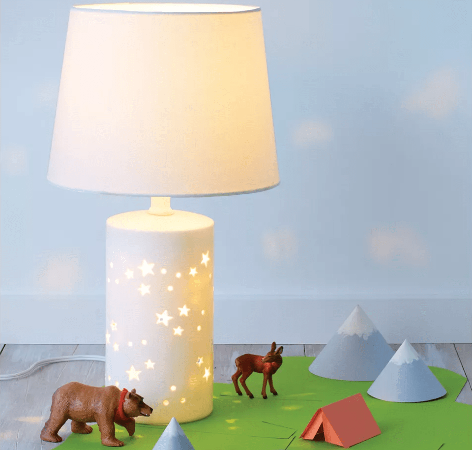 Pillowfort Star Lamp with toys around it