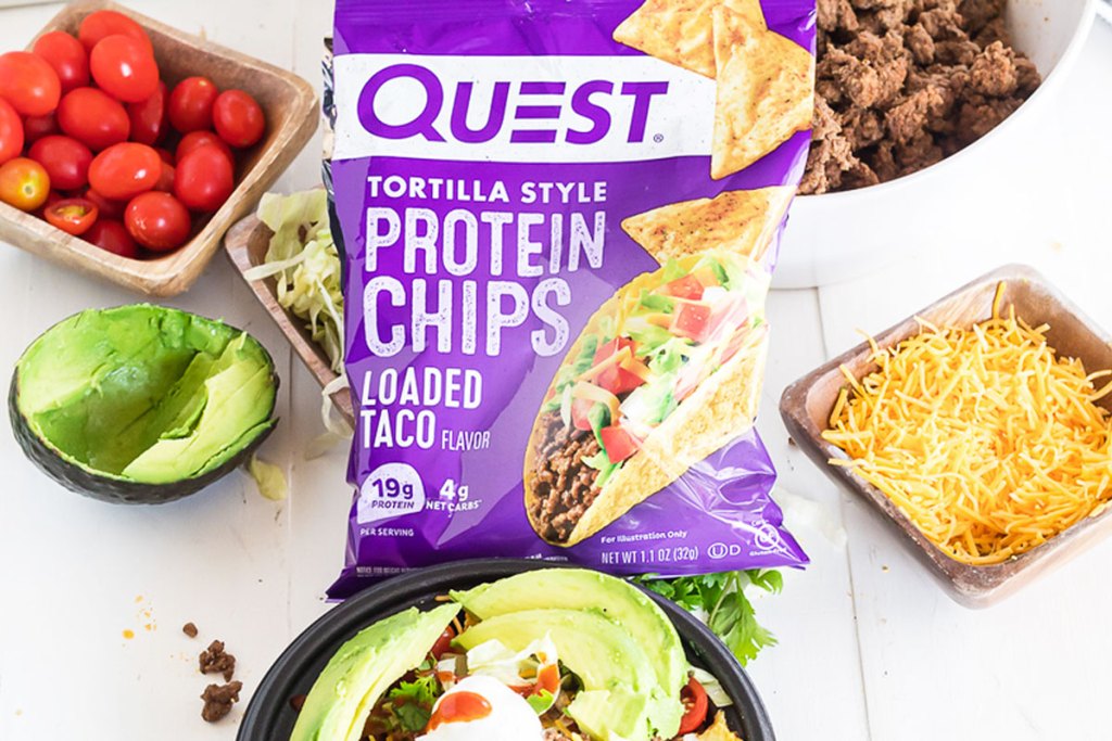 purple bag of quest loaded taco flavor chips in front of taco bowl