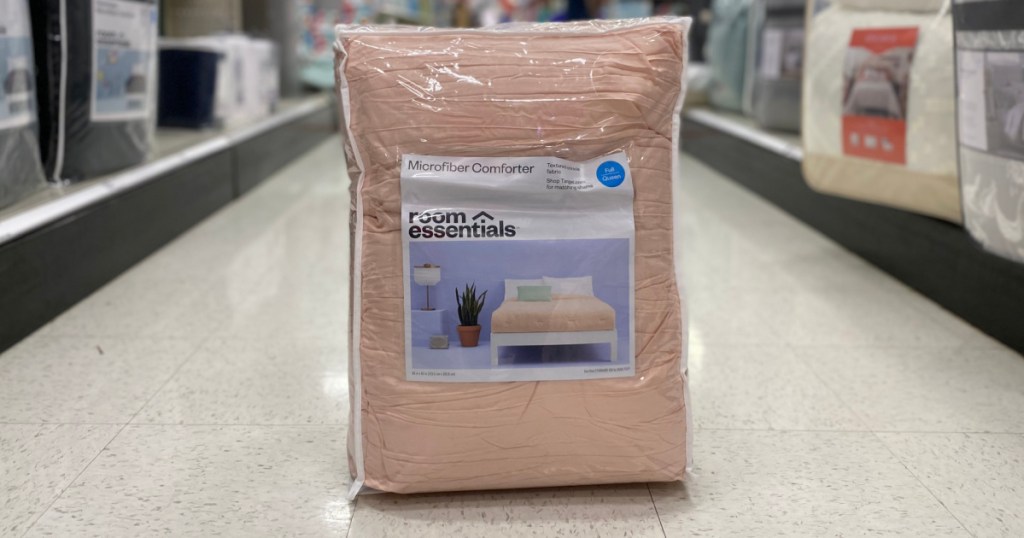 pink comforter in aisle 