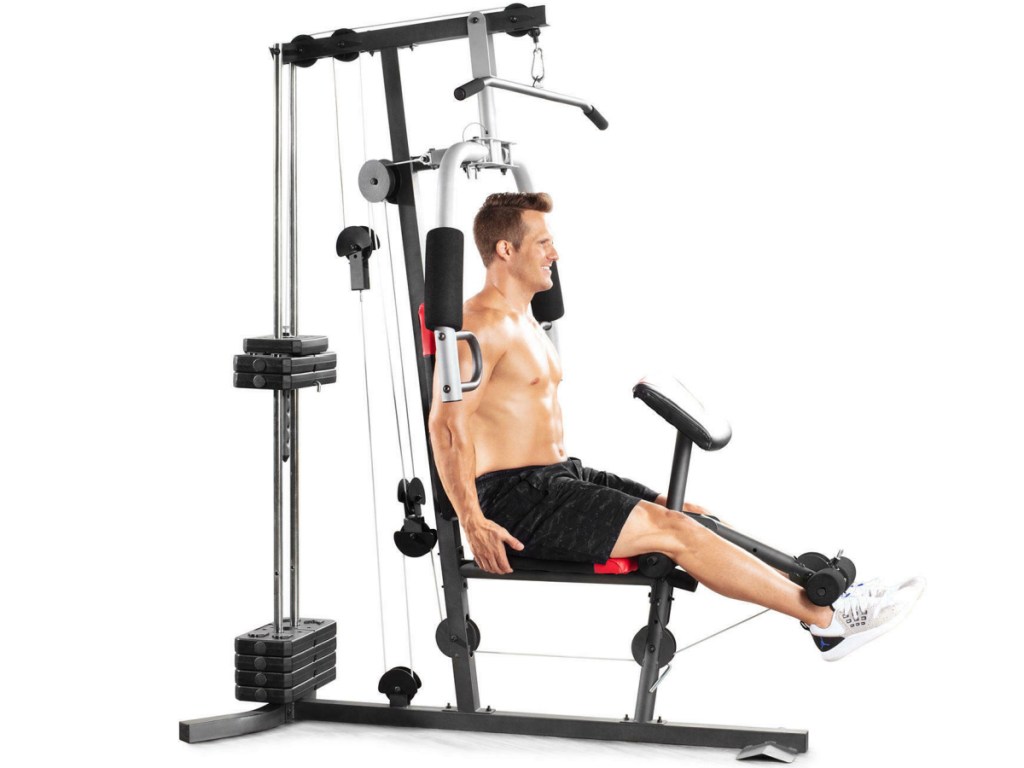 man working out on a home gym system 