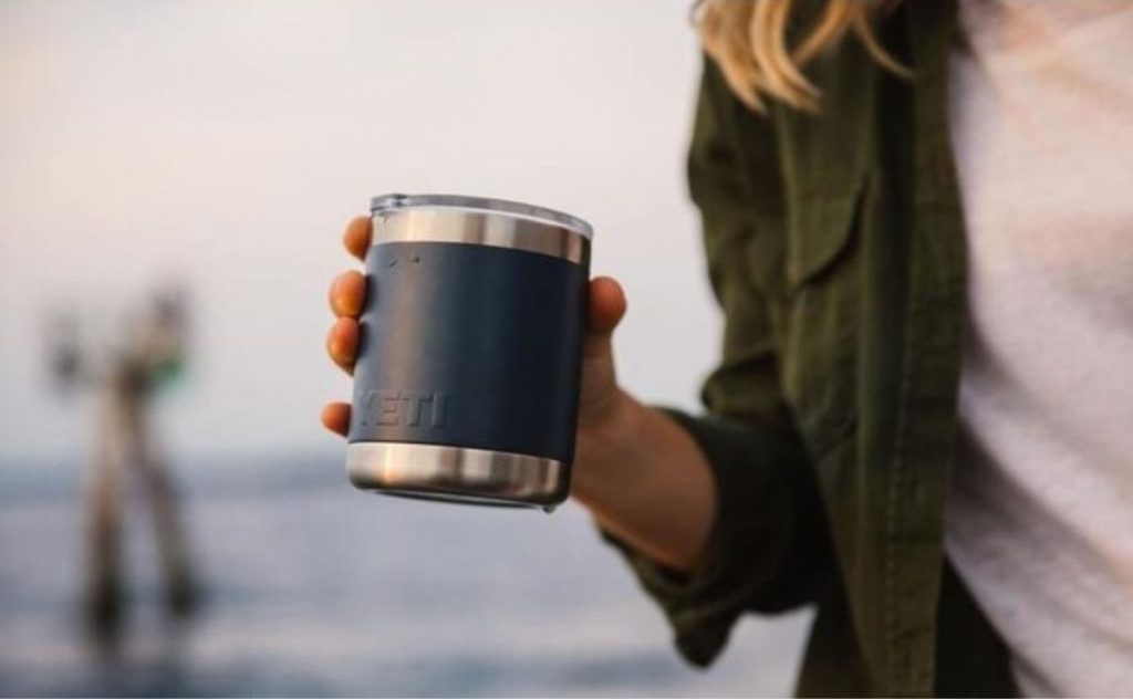 woman holding a Yeti Rambler