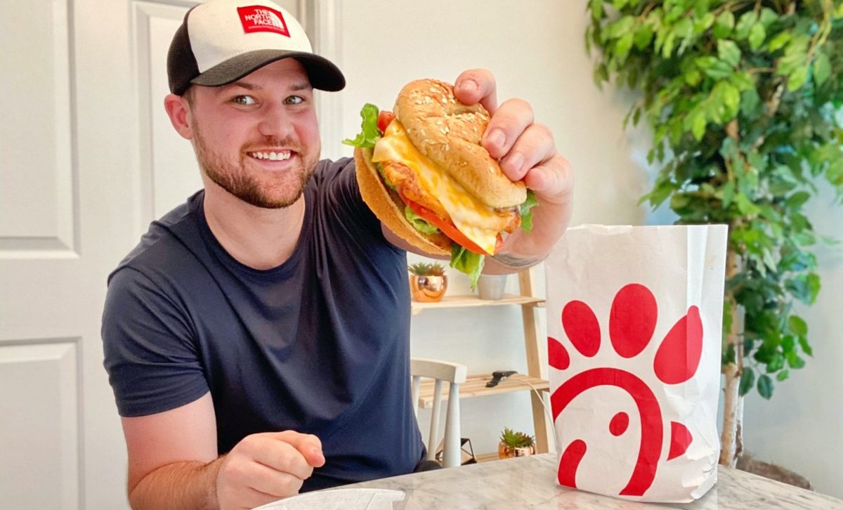 man holding Chick-fil-A sandwich