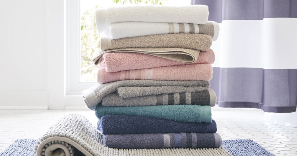 home expressions bath towels stacked in many colors