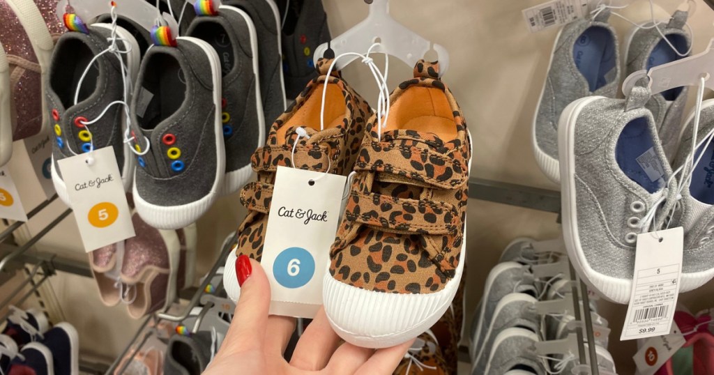 cat & jack kids sneakers in hand in store at target