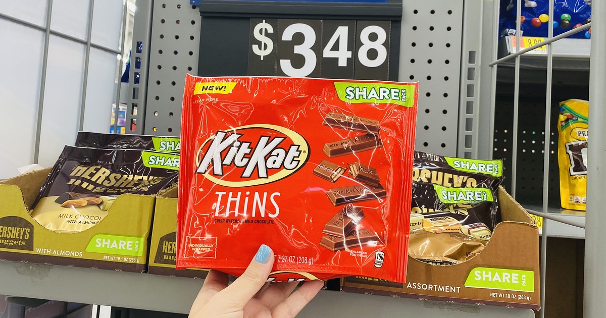 holding package of Kit Kat thins at Walmart