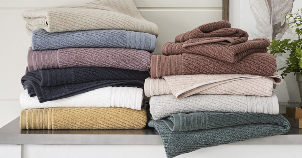 linden bath towels stacked in many colors