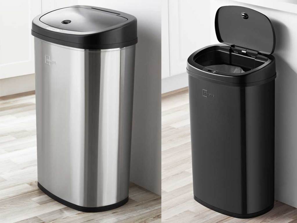 stainless steel and black trash cans in a kitchen