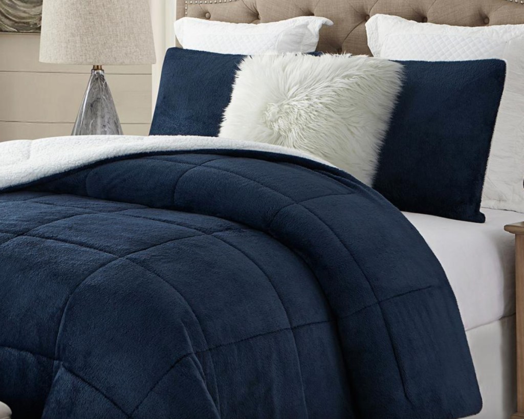 navy faux fur sham on bed