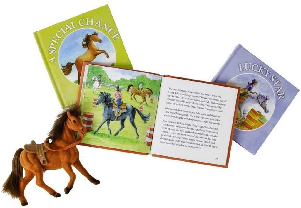 brown toy horse with open book and two closed books