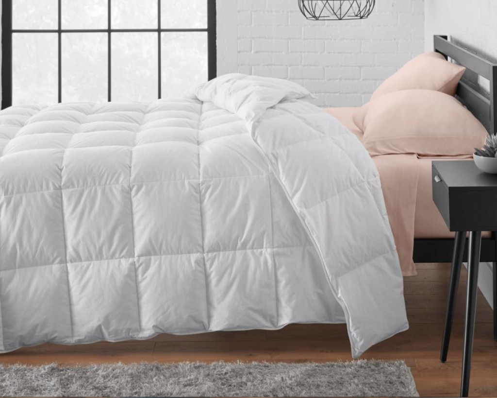 white feather down comforter on bed