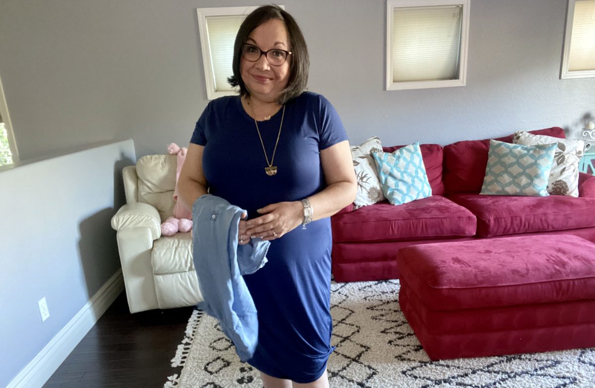 woman wearing a short sleeve blue t-shirt dress