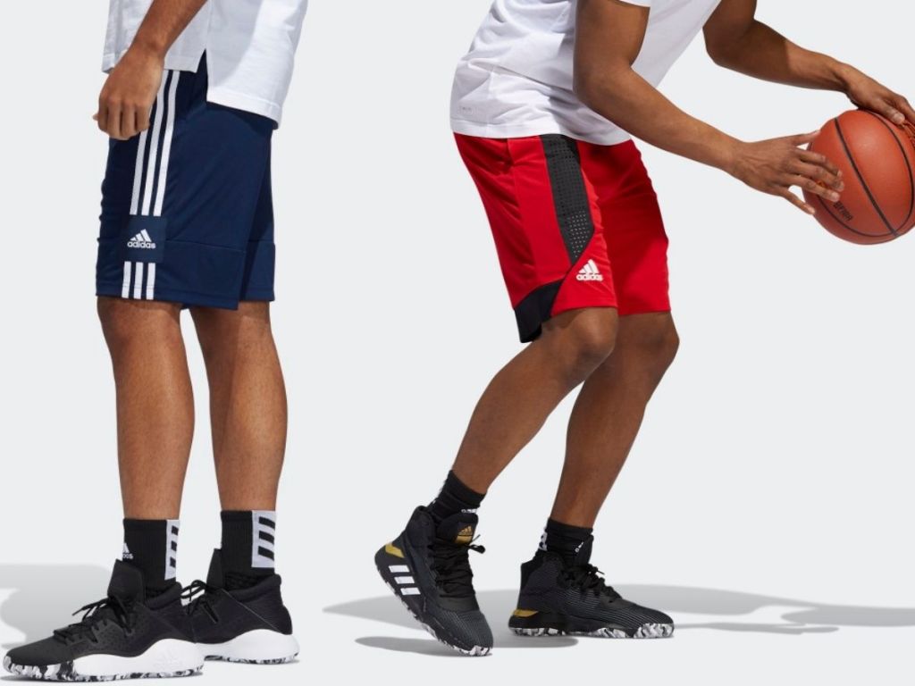 Two men wearing adidas mesh basketball shorts