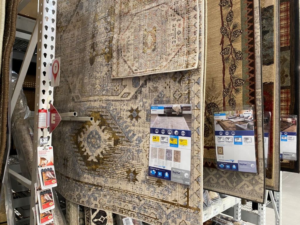 rugs hanging on display at Lowe's