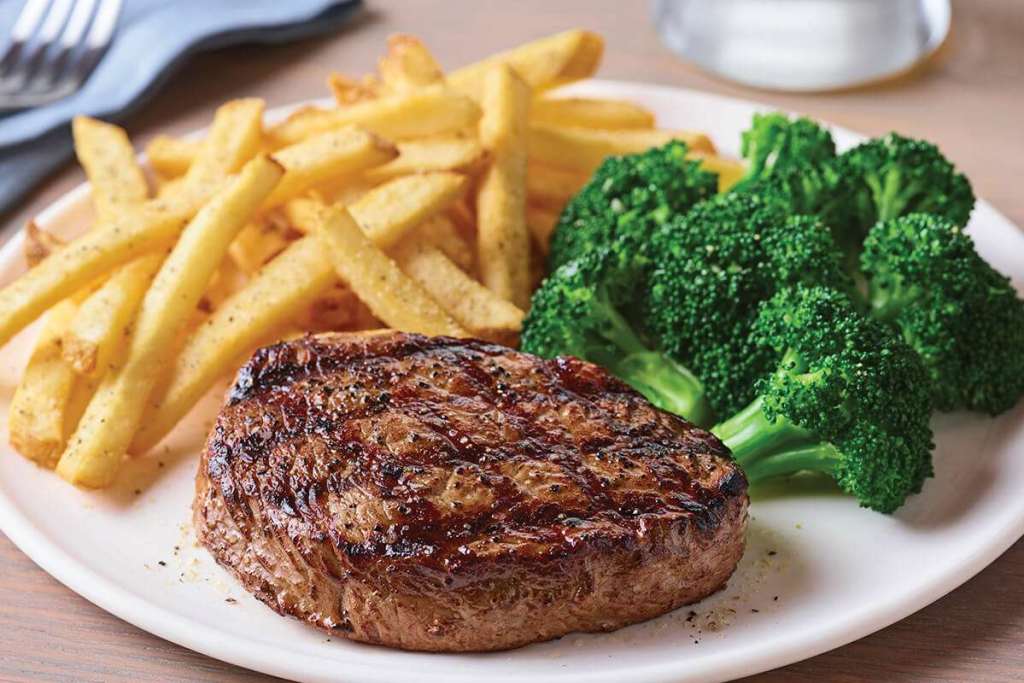 Applebees Steak plate with fries and broccoli