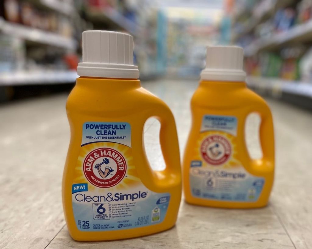 2 Arm & Hammer Laundry Detergents on floor