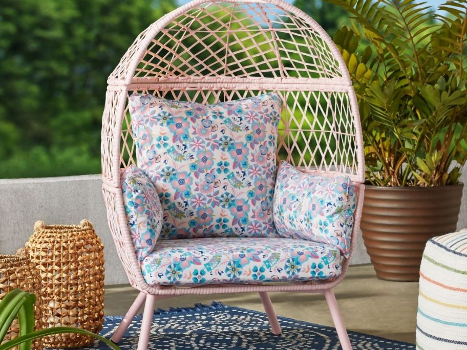 pink kids egg chair on patio