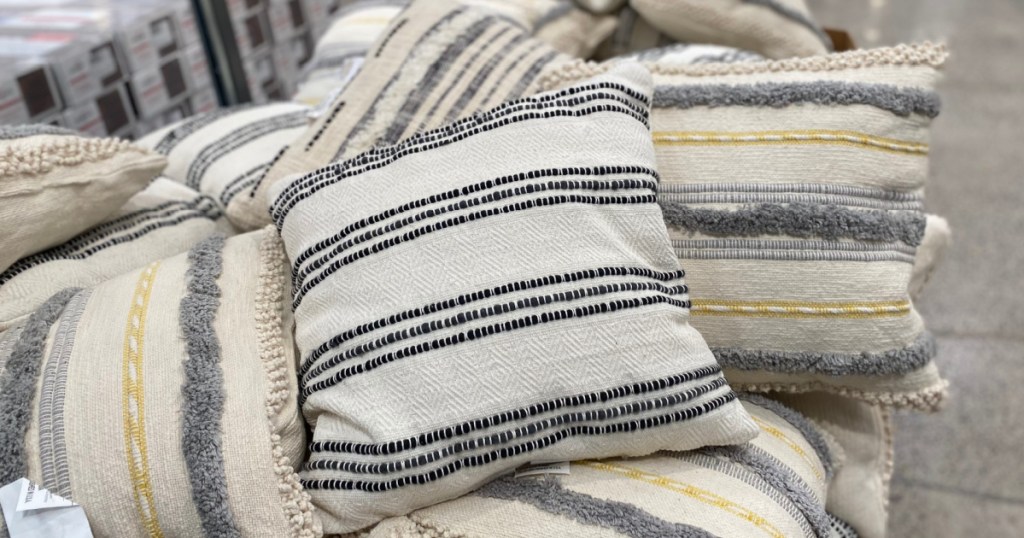 pile of woven pillows in store