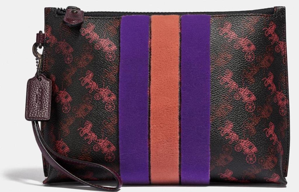 brown, purple, and orange coach purse with horses on it
