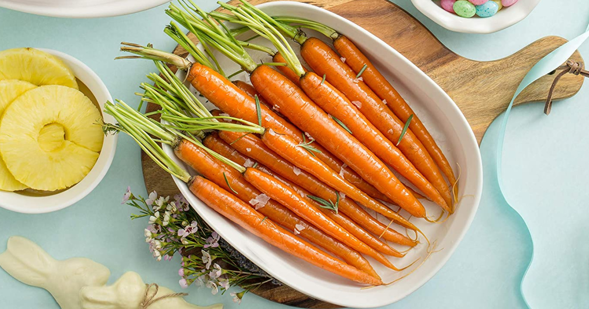 Large casserole dish with carrots on a table