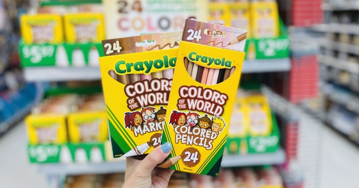 hand holding Crayola Colors of the World Pencils and Markers