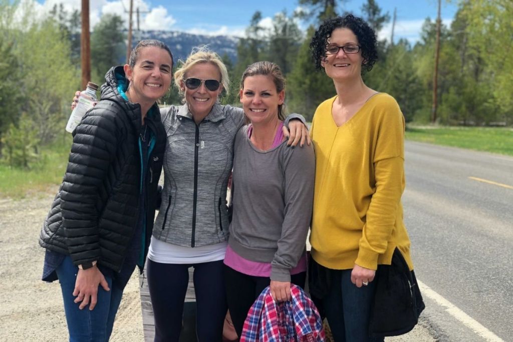 Four women outside smiling