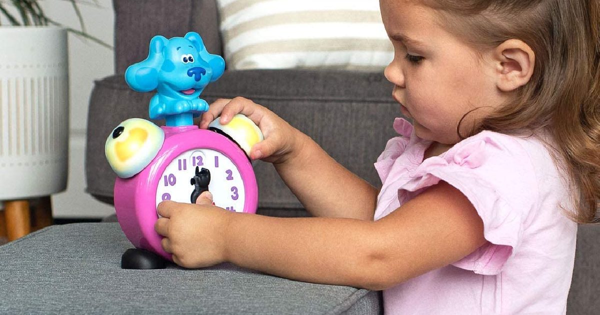 girl playing with LeapFrog Blue's Clue and You! Tickety Tock