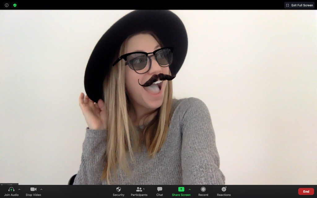 woman posing with black hat and virtual glasses and mustache