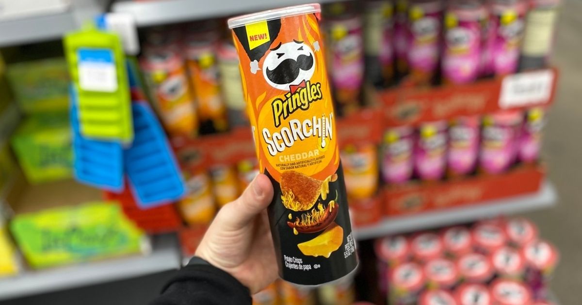 hand holding Pringles Scorchin Chips