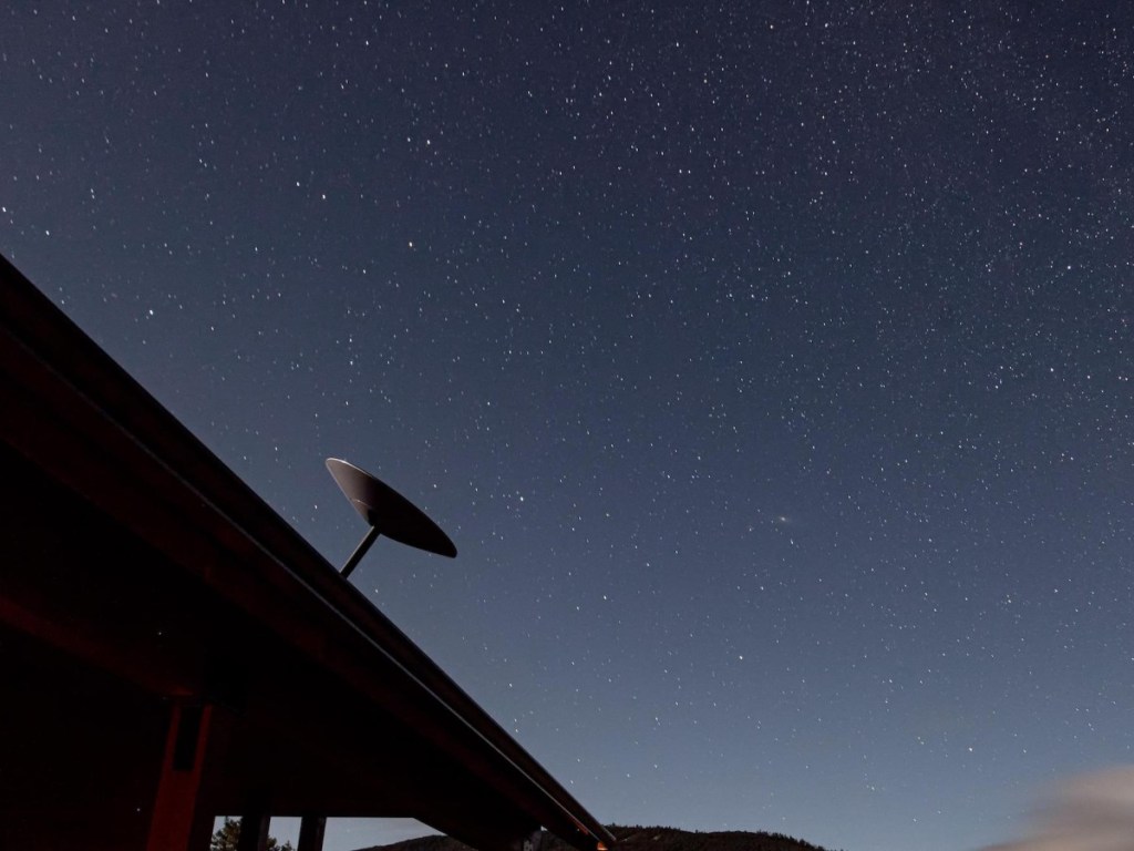 satellite dish against a starry sky