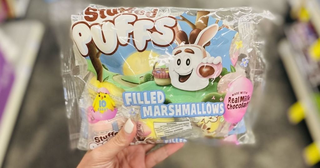 hand holding Stuffed Puffs Milk Chocolate Filled Marshmallows