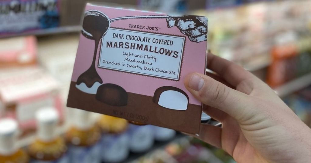 hand holding Trader Joe's Chocolate Covered Marshmallows