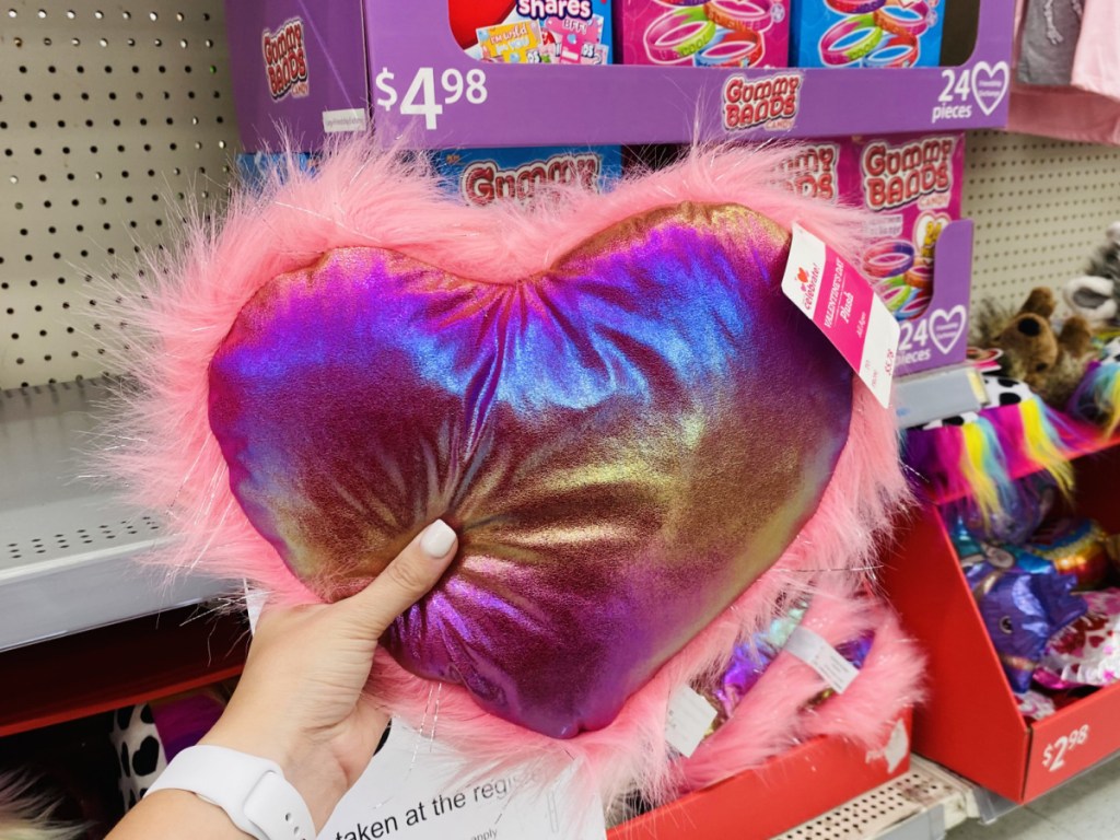 hand holding a plush valentine heart at walmart 