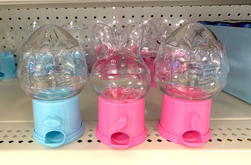 row of easter themed bunny and egg candy dispensers on store shelf