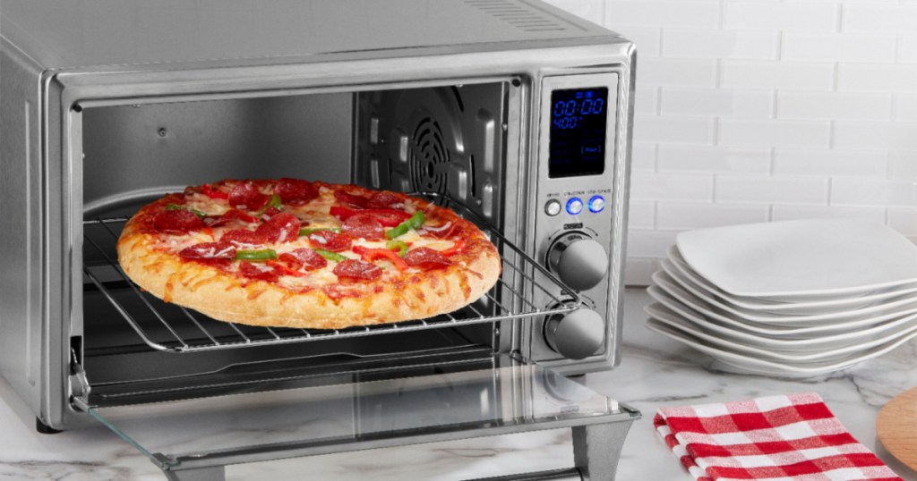 insignia air fryer toaster oven with pizza in it