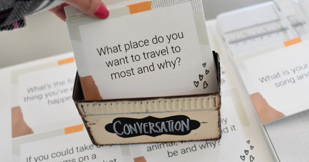 placing free printable conversation cards in a box