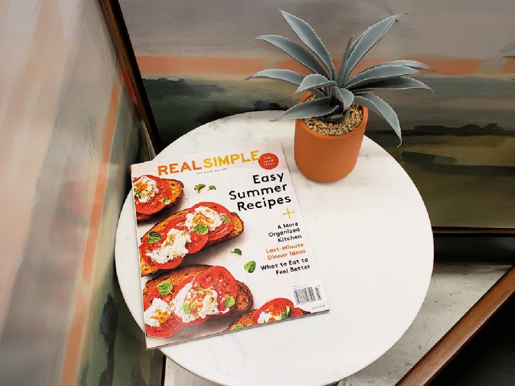 real simple magazine on table with plant