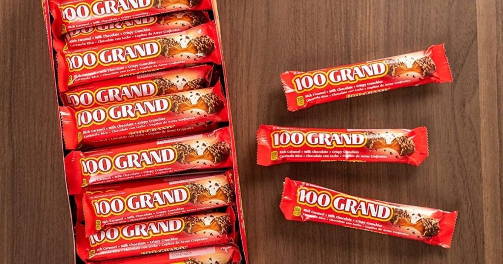100 grand candy bars on table