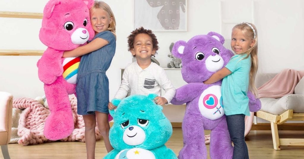 kids holding large Care Bears Plush